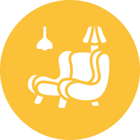 A yellow circle with a chair and lamp in it