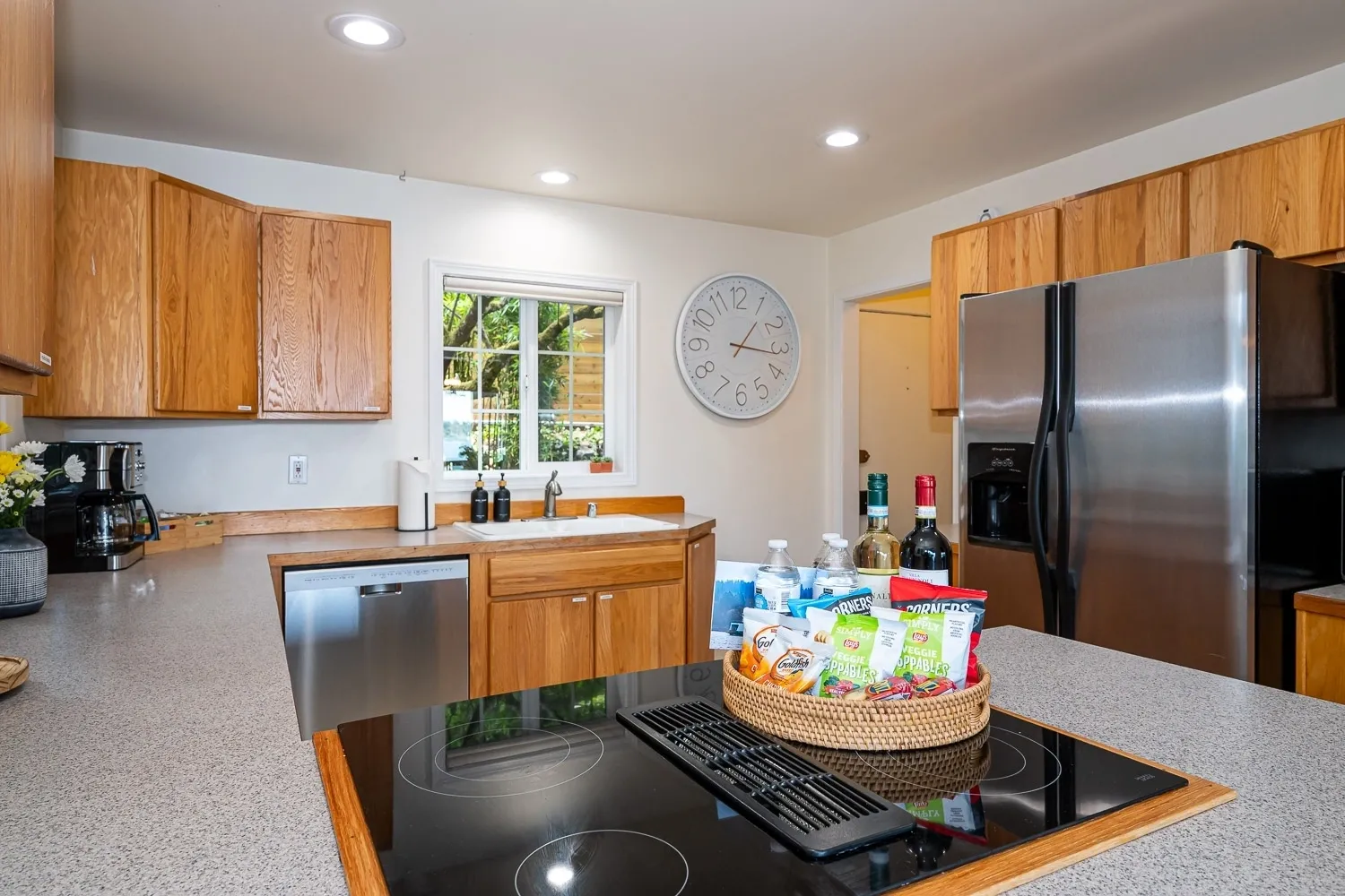 A kitchen with wooden cabinets and stainless steel appliances.